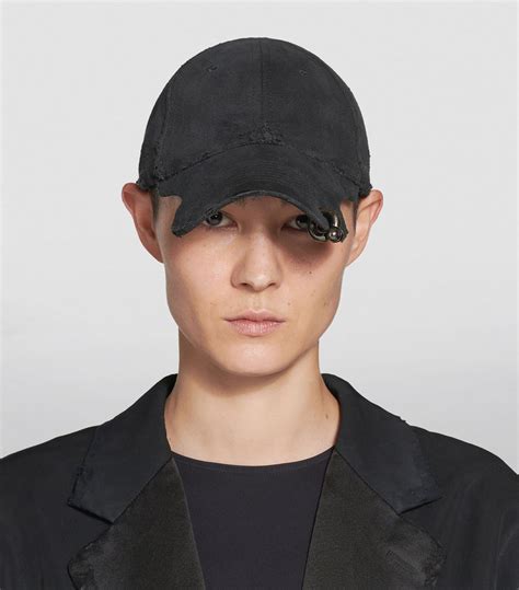 balenciaga pierced cap.